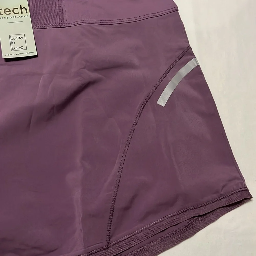 Lucky In Love Womens Tech Flight Short Golf Skort in Dusk Purple NWT